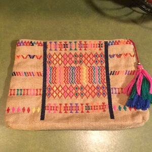 Embroidered clutch with tassel